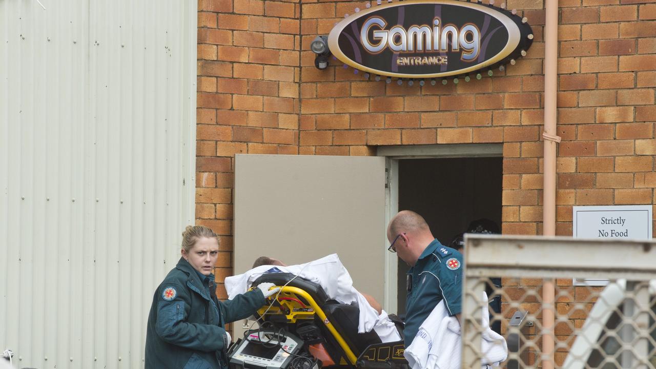 Jamie Ross Cook is taken from the Gowrie Road Hotel by ambulance officers after being injured in the incident.