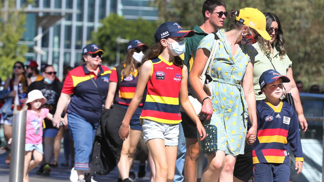 Crows fans stream into the Adelaide Oval.