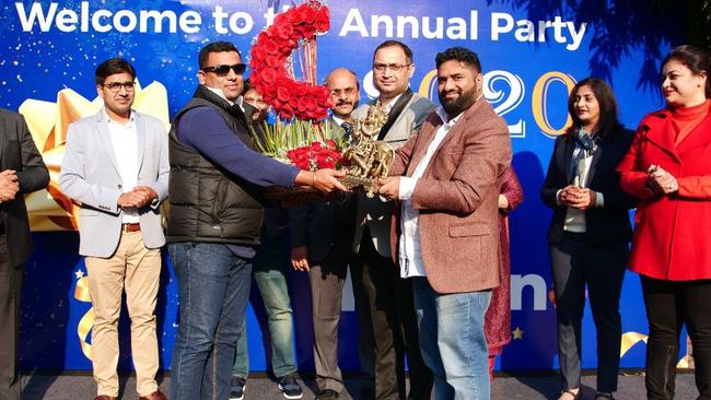 Kalkine chief Kunal Sawhney, wearing sunglasses, and staff in India at the company's 2020 party.