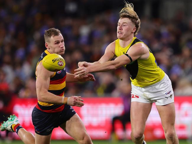 The Tigers and Crows are trading goals. (Photo by Sarah Reed/AFL Photos via Getty Images)