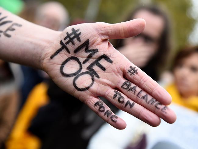 "Me too" on the hand of a protester during a gathering against gender-based and sexual violence. Picture: AFP Photo/Bertrand Guay