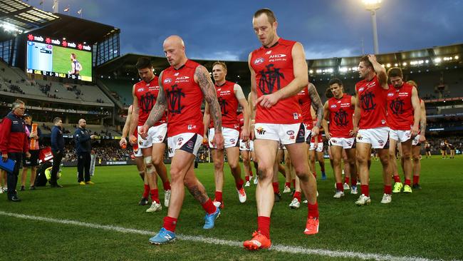 AFL Round 21 - Carlton v Melbourne at MCG, Nathan Jones and Daniel Cross lead the team off after the loss. Melbourne. 23rd August 2015. Picture: Colleen Petch.