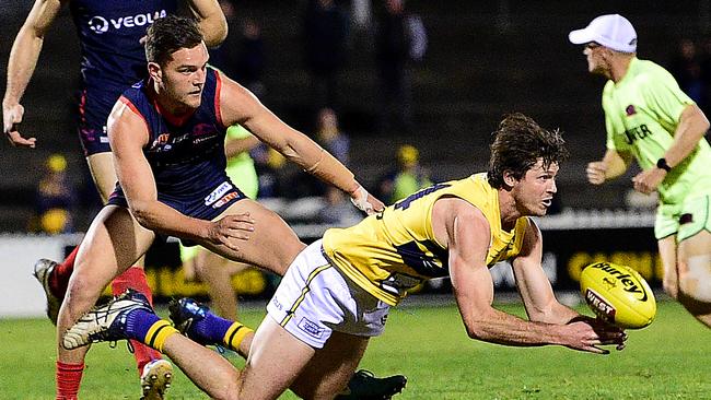 Norwood's Mathew Nunn puts pressure on Eagles defender Jake von Bertouch.  Picture: Bianca De Marchi