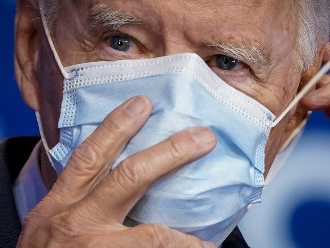 WILMINGTON, DE - OCTOBER 28: Democratic presidential nominee Joe Biden puts on his face mask after making remarks about the Affordable Care Act and COVID-19 after attending a virtual coronavirus briefing with medical experts at The Queen theater on October 28, 2020 in Wilmington, Delaware. Participants in the briefing include former U.S. Surgeon General Dr. Vivek Murthy, Director for Science in the Public Interest Dr. David Kessler, New York University professor Dr. Celine Grounder, and Yale University professor of medicine Dr. Marcella Nunez-Smith.   Drew Angerer/Getty Images/AFP == FOR NEWSPAPERS, INTERNET, TELCOS & TELEVISION USE ONLY ==