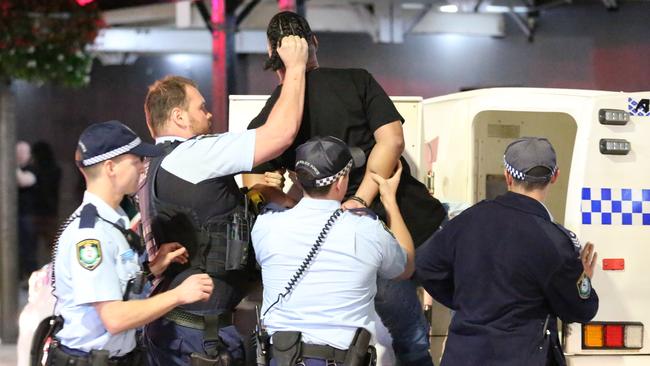 A man is arrested by police in Kings Cross after he was allegedly trying to start fights with strangers.