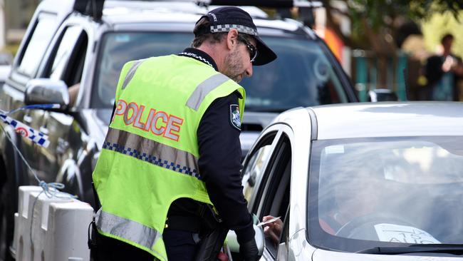 Police check cars at the Queensland border with NSW at Griffith Street in Coolangatta. Picture: Steve Holland