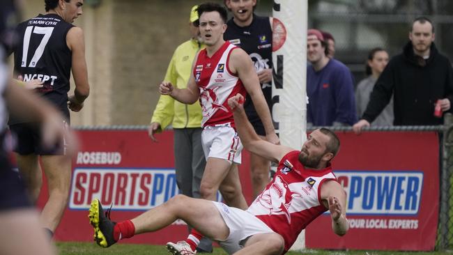 Seb Gotch watches Sorrento teammate Leigh Poholke hit the turf. Picture: Valeriu Campan