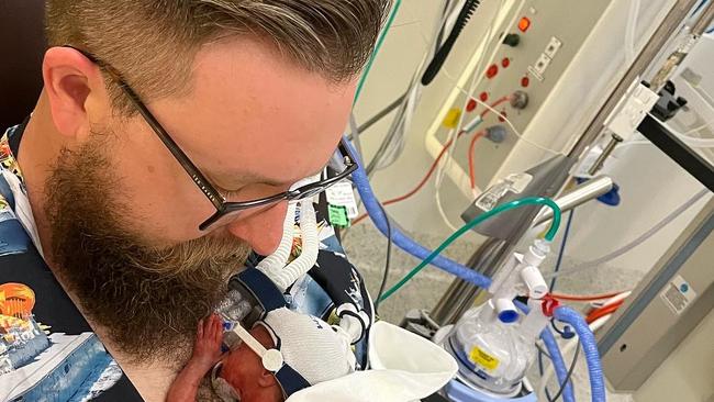 Baby Charlie Streeter having a cuddle with dad Nathan. Sadly Charlie passed away at eight weeks from a disease of the gut called necrotising enterocolitis (NEC). Picture: Supplied