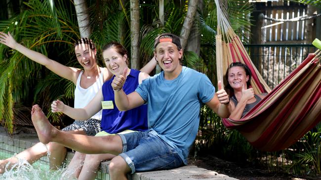 Calypso Inn backpackers Duty Manager Inga Dalzell, second from left, welcomes English travellers Ella Macintosh, Robin Turner and Zara Redford to Cairns. Picture: Stewart McLean