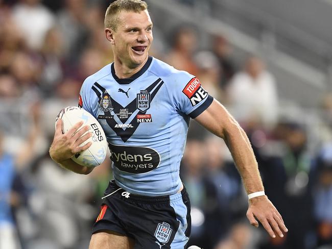 It took several staff members to tear the skin-tight jerseys from the backs of NSW players. Picture: y Ian Hitchcock/Getty Images