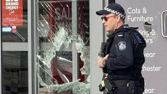 Seven shopfronts were found smashed up at Domain Central in Townsville on Friday morning. Picture: Natasha Emeck