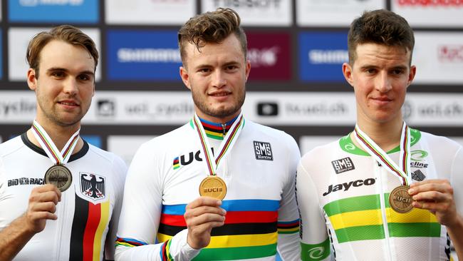 Marco Mathis, centre, celebrates next to second-placed Maximilian Schachmann, left, and Miles Scotson after the Men's U-23 Individual Time in Doha, Qatar. (Photo by Bryn Lennon/Getty Images)