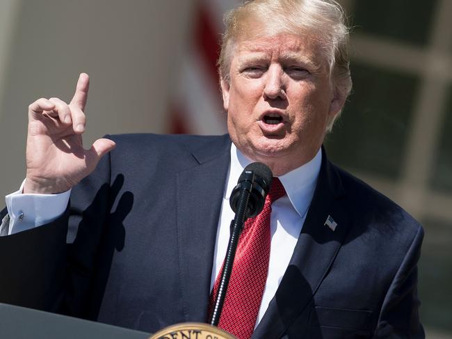 US President Donald Trump speaks before Neil Gorsuch takes the judicial oath during a ceremony in the Rose Garden of the White House April 10, 2017 in Washington, DC. / AFP PHOTO / Brendan Smialowski