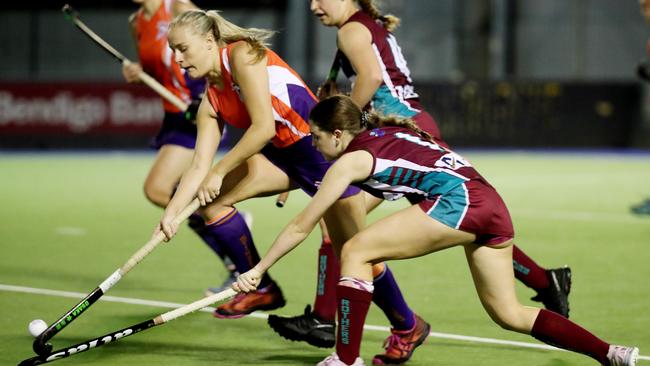 Cairns Hockey Association - Round 3. Brothers v Stingers (A-grade women’s). Stingers' Phoebe Nixon and Brothers' Shayleigh Atkinson. PICTURE: STEWART McLEAN