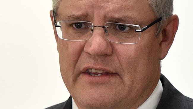 Federal Tresaurer Scott Morrison speaks to the media in Melbourne, Wednesday, June 15, 2016. Morrison was launching a new ad highlighting the possibility of a Greens and Labor minority government. (AAP Image/Julian Smith) NO ARCHIVING