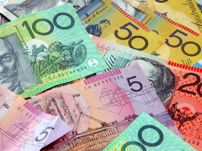 Australian notes scattered on a table. Click to see more...  Picture: istock