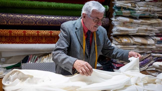 Italian tailor Raniero Mancinelli nearly finishes tailoring the white cassocks for the future Pope in his shop in Rome. The 86-year-old has handcrafted the cassocks for three Popes. Picture: Stefano Costantino/ AFP