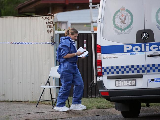 Forensic police at the scene. Picture: Christian Gilles