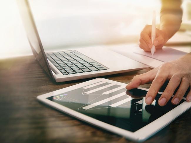 Stock technology photo of iPad and laptop from iStock.