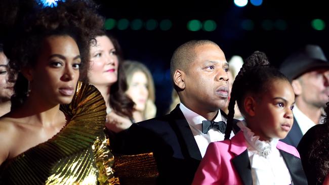 Will we ever get to know the story behind Solange's eyes? Pictured sitting with Jay-Z and Beyonce’s daughter Blue Ivy Carter. Picture: Christopher Polk/Getty 