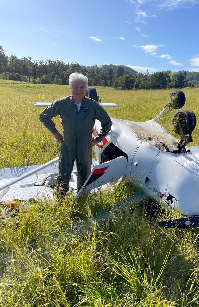 Pilot Vic Pisani next to his crashed plane which he was forced to land in a paddock at Melawondi after the engine cut out, captured by Matt Frost