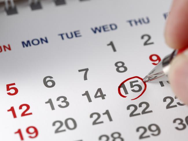 Set a date on the calendar ; shot with very shallow depth of field ,