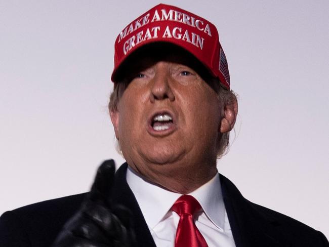 US President Donald Trump speaks to the press at Charlotte Douglas International Airport on November 1, 2020, in Charlotte, North Carolina. - Donald Trump vowed to again defy the polls as he sprinted through five swing states in a blitz of campaigning against Joe Biden with just two days left before a US presidential election that has already mobilized a record number of early voters. (Photo by Brendan Smialowski / AFP)