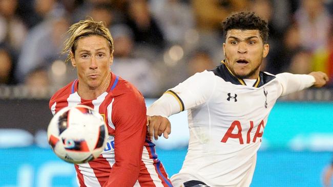 Deandre Yedlin of Tottenham Hotspur spoils a shot at goals by Fernando Torres of Atletico Madrid.