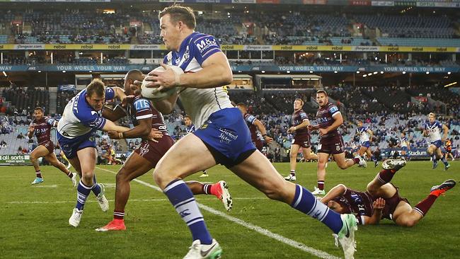 Brett Morris races away to score a try for the Bulldogs.