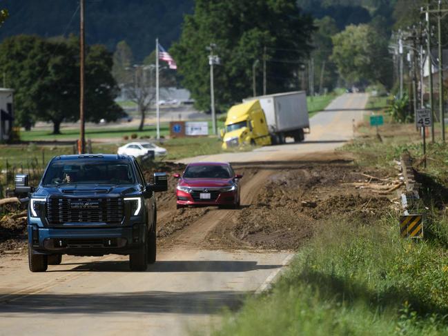 People cross a damaged bridge on Highway 70 in the aftermath of Hurricane Helene in Old Fort, North Carolina. Picture: Getty Images via AFP