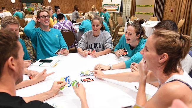 Australian swimming team members playing Uno at the team hotel during their training camp in Alabama.