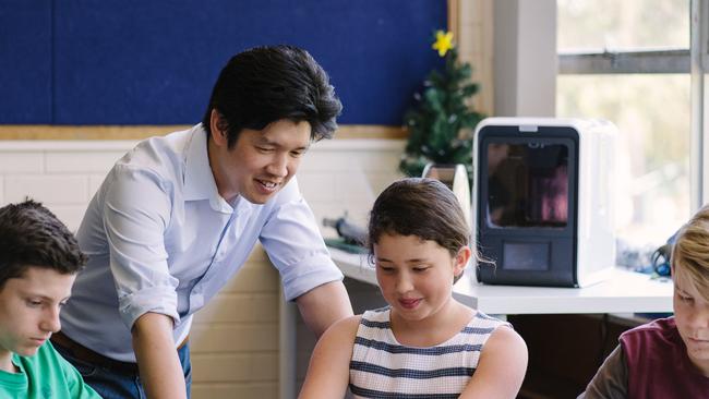 Maker's Empire co-founder Jon Soong with some of the students trying out Maker's Empire 3D software. Pic Supplied.