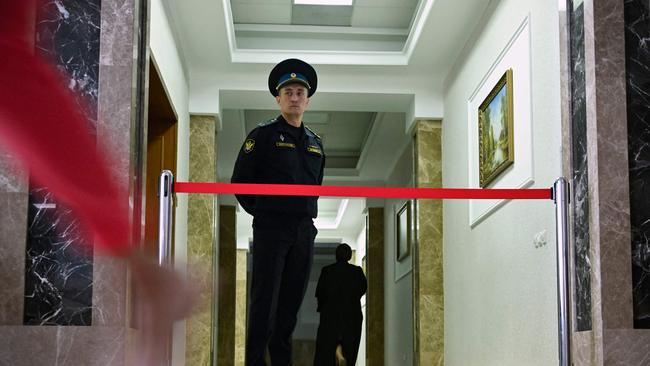 A court bailiff blocks a hallway of the Sverdlovsk Regional Court during a hearing in the trial of Evan Gershkovich on Thursday. Picture: Alexander Nemenov / AFP