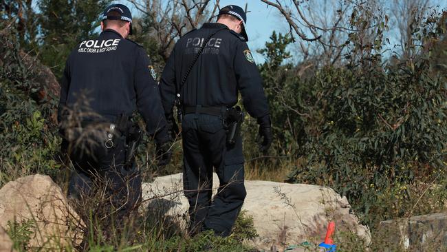 Police comb bushland off Heathcote Road for clues. Picture:Justin Lloyd