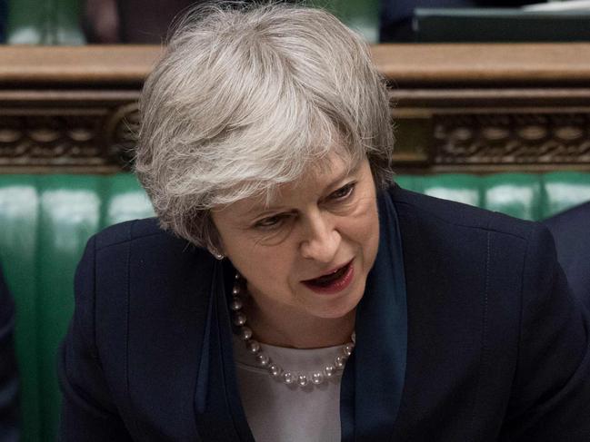 A handout photograph released by the UK Parliament shows Britain's Prime Minister Theresa May (C) making a statement in the House of Commons in London on January 15, 2019 directly after MPs rejected the government's Brexit deal. - Britain's parliament on Tuesday resoundingly rejected Prime Minister Theresa May's Brexit deal, triggering a no-confidence vote in her government and leaving the country on track to crash out of the EU. (Photo by Jessica TAYLOR / UK PARLIAMENT / AFP) / RESTRICTED TO EDITORIAL USE - NO USE FOR ENTERTAINMENT, SATIRICAL, ADVERTISING PURPOSES - MANDATORY CREDIT " AFP PHOTO / Jessica Taylor / UK Parliament"