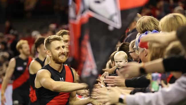 Dyson Heppell leads the celebrations with fans at Marvel Stadium. Picture: Getty Images