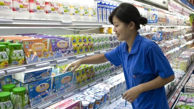 China’s Mengniu Dairy is the biggest producer of milk in its home market but won’t be allowed to buy Lion’s assets from Kirin in Australia. Picture: Bloomberg