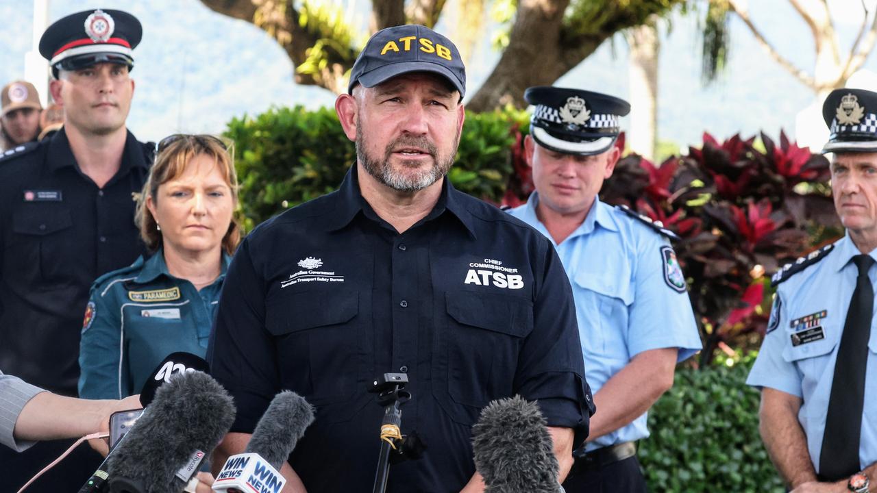 Australian Transport Safety Bureau Chief Commissioner Angus Mitchell speaks on the Cairns Esplanade, where a stolen helicopter on an unauthorised flight crash landed at about 1:50am Monday, killing the pilot. Picture: Brendan Radke