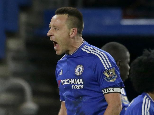 Chelsea's captain John Terry, left, celebrates scoring his side's third goal to draw the game 3-3 during the English Premier League soccer match between Chelsea and Everton at Stamford Bridge stadium in London, Saturday, Jan. 16, 2016. (AP Photo/Matt Dunham)