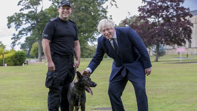 Boris Johnson meets police dog handler Chris Morrison with charge Eli during a visit to the Scottish Police College at Tulliallan on Wednesday. Picture: Getty