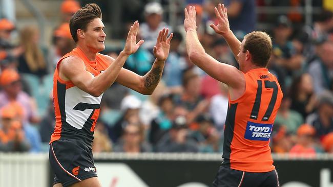 Rory Lobb celebrates a goal with Steve Johnson.