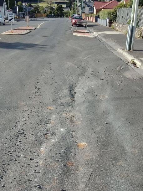 Scenes from a burst water incident at Burnette and Pioneer Streets in New Norfolk which has left some sections of road compromised. Source: MICHELLE DRACOULIS.