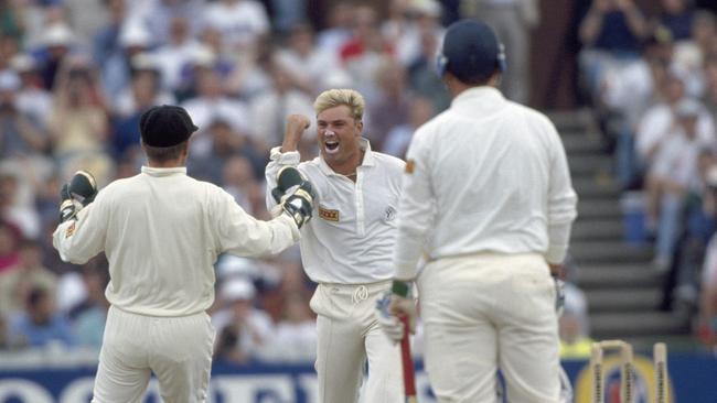 Shane Warne with Ian Healy (L) after bowling Mike Gatting with the Ball of the Century.