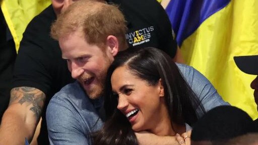 Prince Harry and Meghan Markle put on a loved up display at the Invictus Games. Picture: Supplied