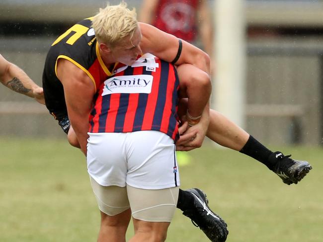 Southern league Div 1: Dingley v East Malvern.David Ismail with the ball for East Malvern is Tackled.Picture: Stuart Milligan