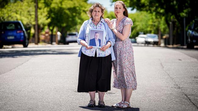 Wendy Curtis, holding a picture of her husband Brenton, with daughter Kimberly Gilmour.