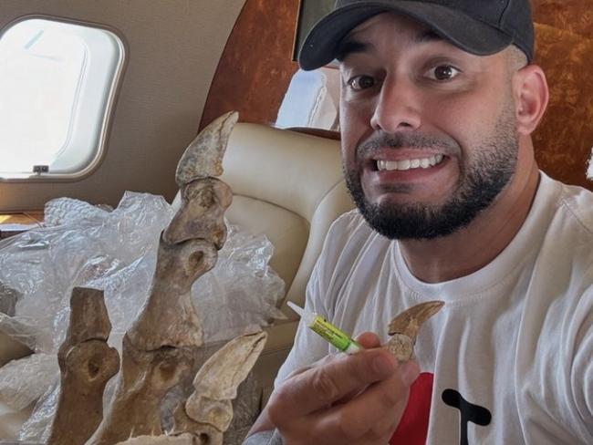 Adrian Portelli with a T-Rex foot he bought for $130,000. Picture: Instagram