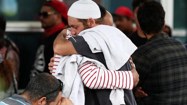 Friends and family of the victims gather at the support centre at the Hagley Community College in Christchurch. Picture: Fiona Goodall/Getty Images.