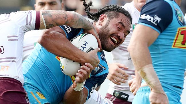 GLADSTONE, AUSTRALIA — APRIL 08: Konrad Hurrell of the Titans is tackled during the round five NRL match between the Gold Coast Titans and the Manly Sea Eagles at Marley Brown Oval on April 8, 2018 in Gladstone, Australia. (Photo by Jono Searle/Getty Images)