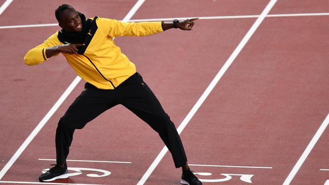 Jamaica's Usain Bolt poses as he takes part in a lap of honour on the final day of the 2017 IAAF World Championships. AFP PHOTO / Antonin THUILLIER.